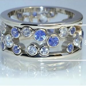 The Dot Modern floating 925 Silver filled round blue sapphire ring